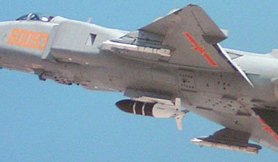 LS-6 carried under the fuselage of a J-8F fighter with its wings in the compact folded position